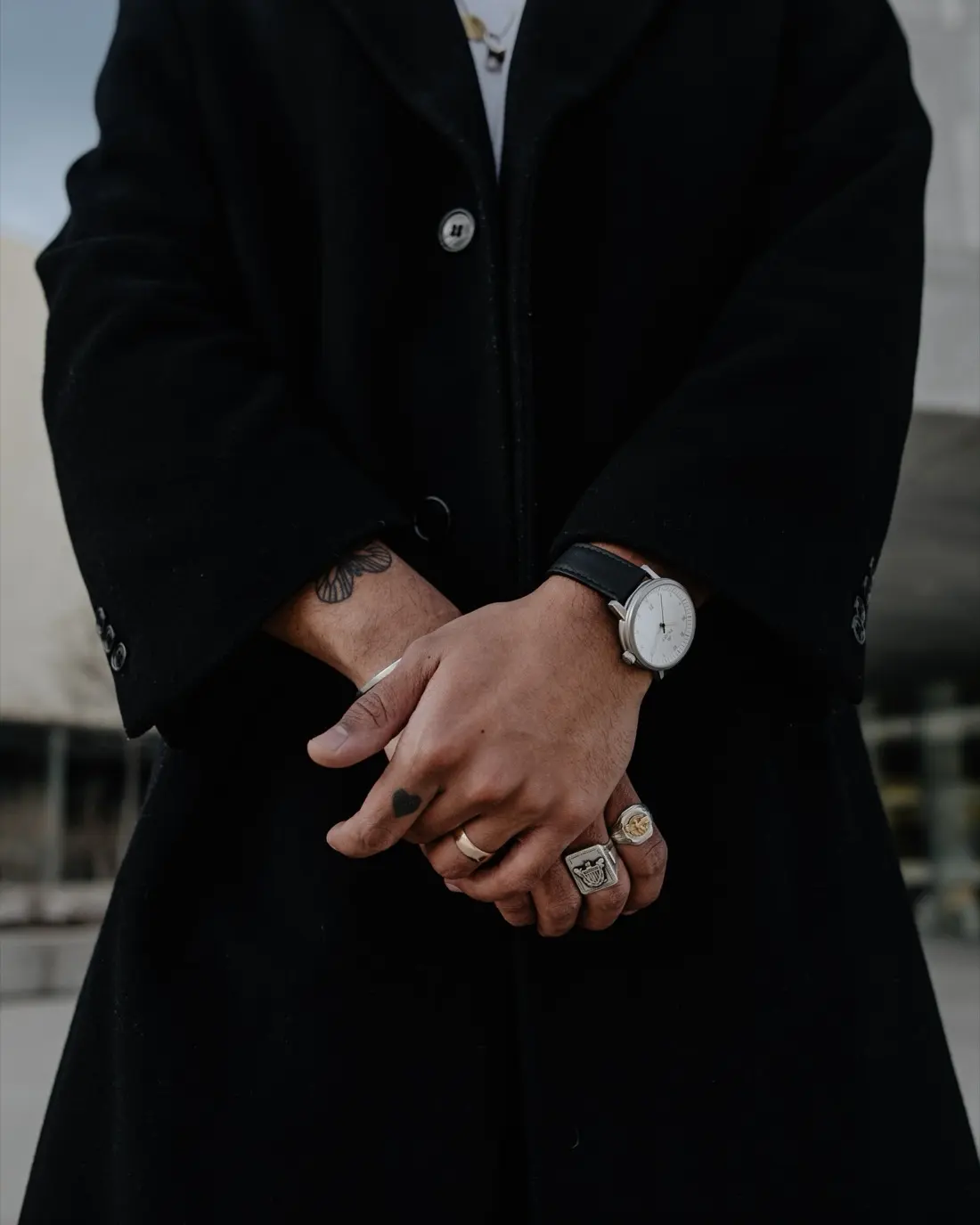 A silver Aspect on black leather, worn under a long black coat